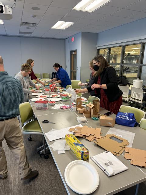 Enrollment staff putting together boxes of cookies