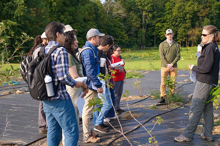 Group of visitors listens to COLSA professor